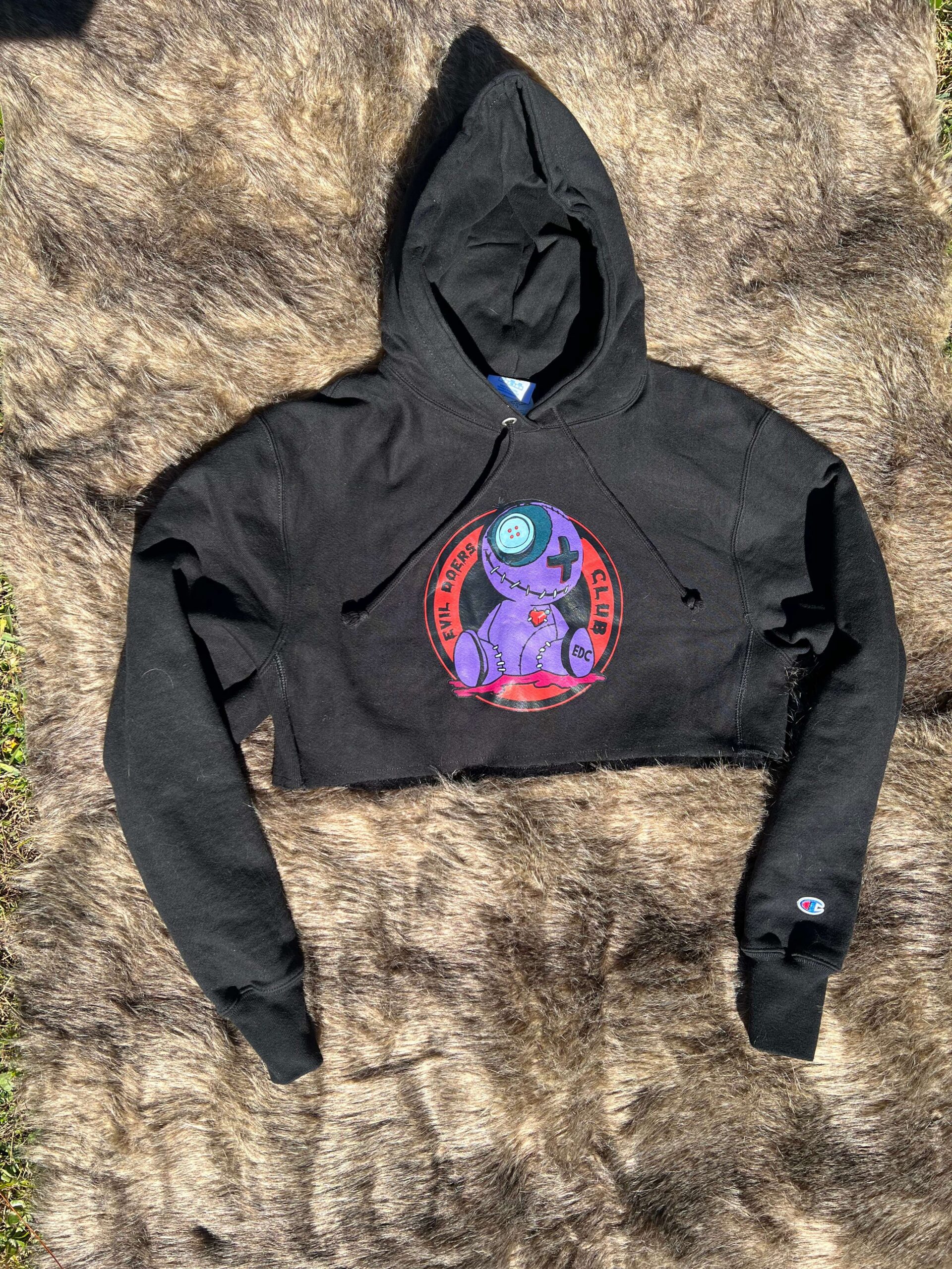 Black Crop Top Hoodie With Circular Voodoo Doll Logo
